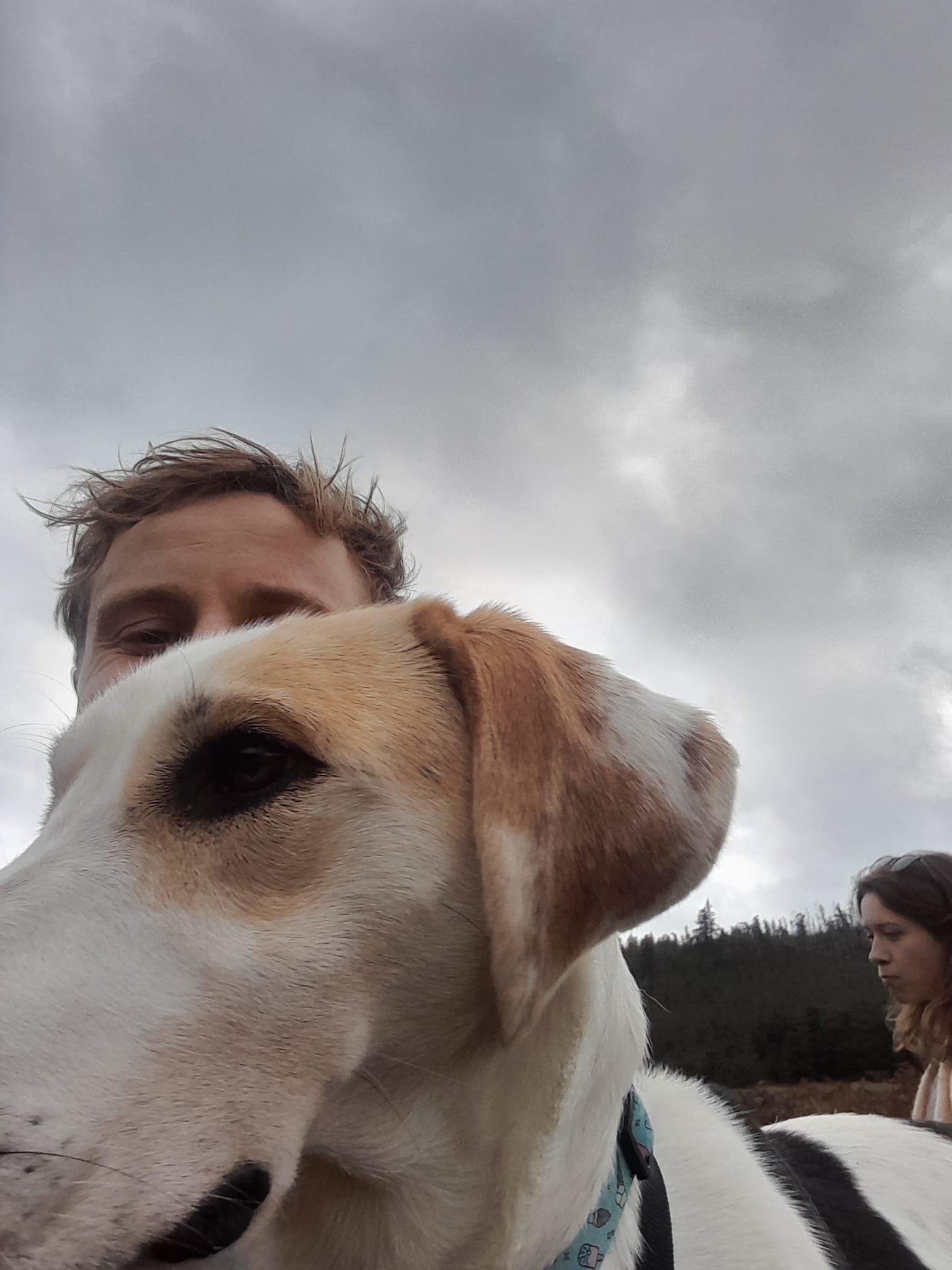 Nick outdoors with dog