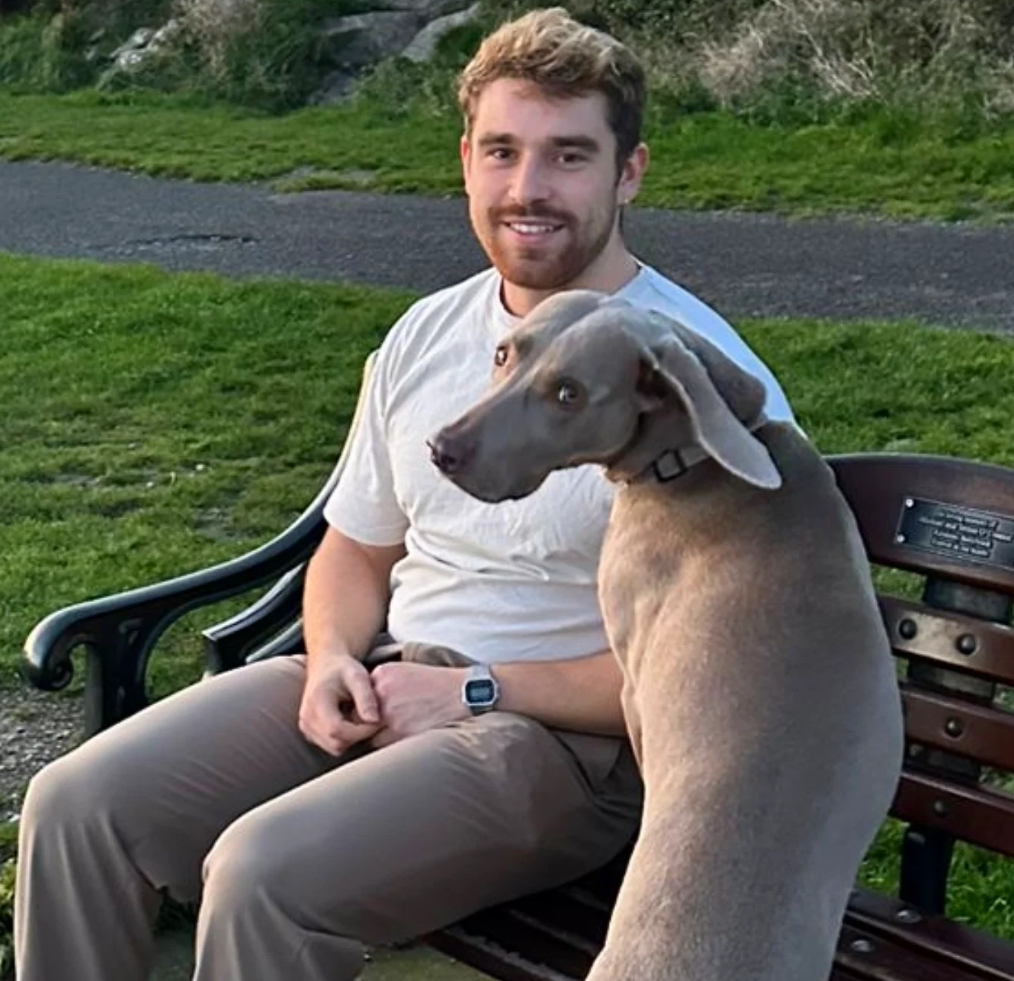 Nick sitting on park bench with a Weimaraner dog in Dublin